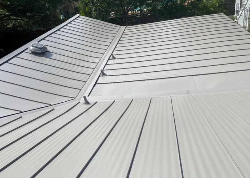 Solar attic fan installed on a metal roof for Roof Ventilation in Fruitvale